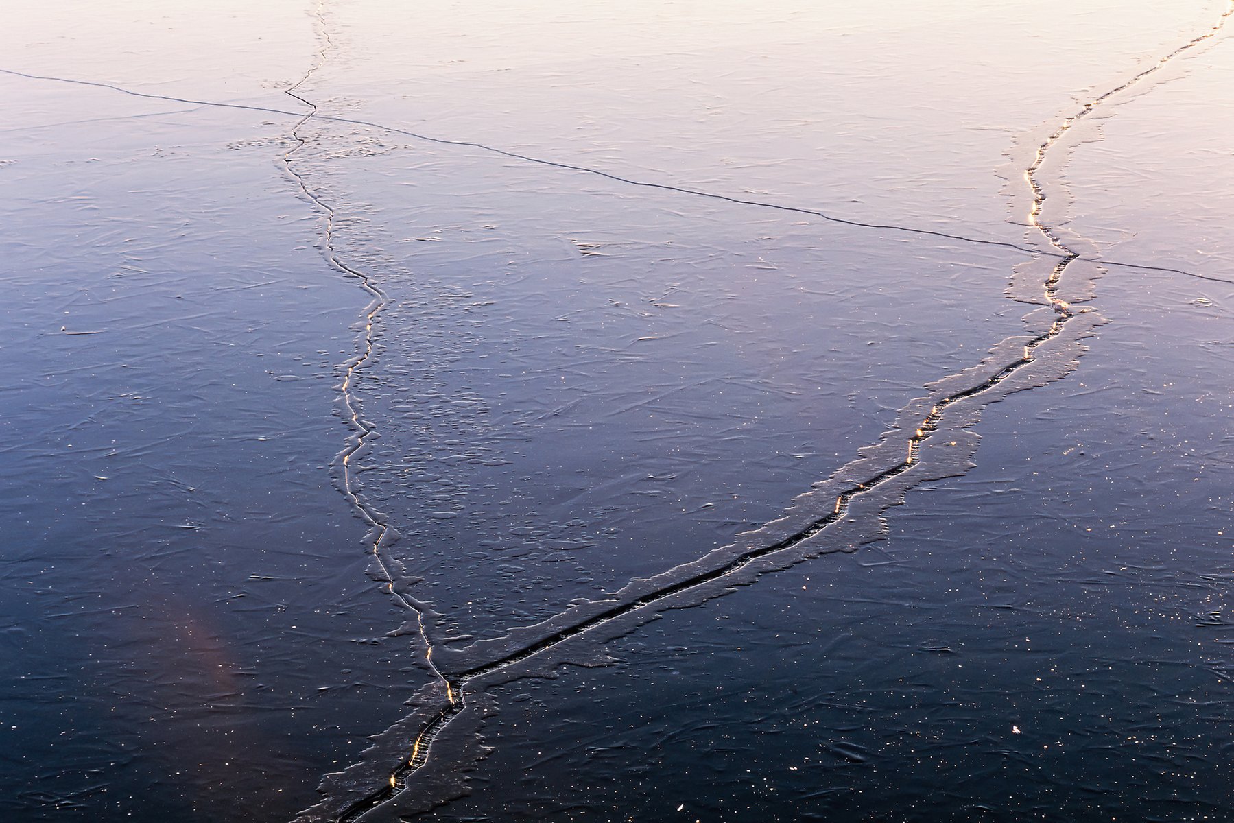 mp69147308-cracks-in-the-ice-on-a-lake-a-cold-winter-day.jpg