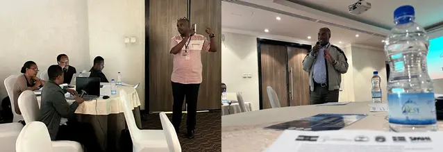 Två personer presenterar inför en grupp.