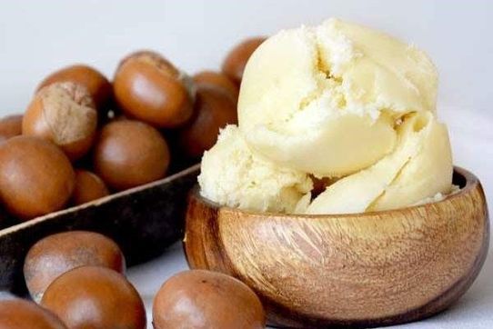 Figure that is a photo of shea butter and shea nuts,