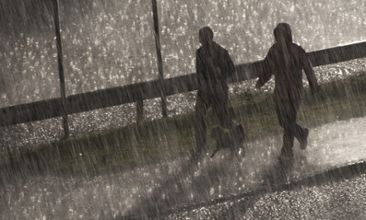 People walking in heavy rainfall
